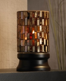 Create a cozy ambiance with this hurricane candle holder. Amber, pearl and multi-colored glass panels create a striking pattern and soft glow that usher warmth into your home. Create a cozy ambiance with this hurricane candle holder. Amber, pearl and multi-colored glass panels create a striking pattern and soft glow that usher warmth into your home.