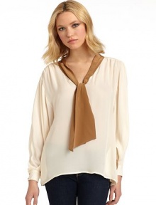 THE LOOKColorblock designPullover styleTie neckLong dolman sleeves with button cuffsPleated shouldersSide seam pocketsBack gusset pleatTHE FITAbout 27 from shoulder to hemTHE MATERIALSilkCARE & ORIGINDry cleanImportedModel shown is 5'10 (177cm) wearing US size Small. THE LOOKColorblock designPullover styleTie neckLong dolman sleeves with button cuffsPleated shouldersSide seam pocketsBack gusset pleatTHE FITAbout 27 from shoulder to hemTHE MATERIALSilkCARE & ORIGINDry cleanImportedModel shown is 5'10 (177cm) wearing US size Small.
