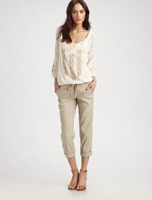Pair this delicately embroidered cotton staple with flared jeans and chunky wedges for a hippie-chic ensemble that's bound to turn heads. V-neck with self tiesThree-quarter bishop sleevesElasticized hemCottonDry cleanImportedModel shown is 5'10 (177cm) wearing US size Small. Pair this delicately embroidered cotton staple with flared jeans and chunky wedges for a hippie-chic ensemble that's bound to turn heads. V-neck with self tiesThree-quarter bishop sleevesElasticized hemCottonDry cleanImportedModel shown is 5'10 (177cm) wearing US size Small.