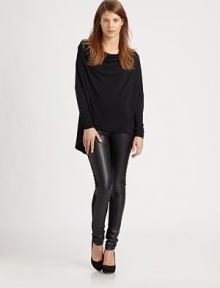 Carefree hi-lo tee has a modified cowlneck, dropped shoulders and long dolman sleeves. Modified cowlneckDropped shouldersLong dolman sleevesHi-lo hem hits below the hips92% polyester/8% spandexMachine washMade in USA of Italian fabricModel shown is 5'10 (177cm) wearing US size Small. Carefree hi-lo tee has a modified cowlneck, dropped shoulders and long dolman sleeves. Modified cowlneckDropped shouldersLong dolman sleevesHi-lo hem hits below the hips92% polyester/8% spandexMachine washMade in USA of Italian fabricModel shown is 5'10 (177cm) wearing US size Small.