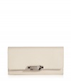 Bring a luxe accent to the everyday with this python-trimmed wallet from Michael Kors - Classic envelope shape, front flap with silver-tone detail with python trim, internal zip pocket with card slots - Perfect for everyday use or as a thoughtful gift