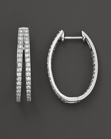 Diamonds set in 14K. white gold hoops. Diamonds set in 14K. white gold hoops.