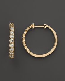 Diamonds set in 14K. yellow gold hoops. Diamonds set in 14K. yellow gold hoops.