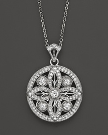 Faceted diamonds set in a gorgeous baroque 14K. white gold pendant. Faceted diamonds set in a gorgeous baroque 14K. white gold pendant.