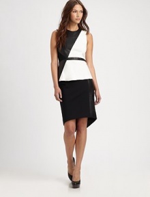 Enter fashion territory with this kicky peplum top, defined by contrasting leather paneling that forms an asymmetrical pattern. RoundneckSleevelessPeplum hemExposed back zipperBody: LeatherTrim: Rayon/nylon/polyurethaneDry clean with leather specialistImportedModel shown is 5'9½ (176cm) wearing US size 4. Enter fashion territory with this kicky peplum top, defined by contrasting leather paneling that forms an asymmetrical pattern. RoundneckSleevelessPeplum hemExposed back zipperBody: LeatherTrim: Rayon/nylon/polyurethaneDry clean with leather specialistImportedModel shown is 5'9½ (176cm) wearing US size 4.