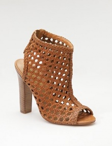 With the rich look of rattan, this striking sandal boot of woven leather has an open toe and back, plus an elastic inset for slip-into ease.Stacked heel, 4½ (115mm) Shaft, 2 Leg circumference, 11 Back elastic inset Leather lining and sole Padded insole ImportedOUR FIT MODEL RECOMMENDS ordering true size. With the rich look of rattan, this striking sandal boot of woven leather has an open toe and back, plus an elastic inset for slip-into ease.Stacked heel, 4½ (115mm) Shaft, 2 Leg circumference, 11 Back elastic inset Leather lining and sole Padded insole ImportedOUR FIT MODEL RECOMMENDS ordering true size.