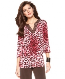 Make a statement in this Ellen Tracy tunic. Beading at the neckline adds a glam touch to on-trend animal print, and the tunic length is ultra-flattering, too! Make a statement in this Ellen Tracy tunic. Beading at the neckline adds a glam touch to on-trend animal print, and the tunic length is ultra-flattering, too!