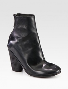 Instantly cool leather essential with a powerful stacked heel. Stacked heel, 4 (100mm)Leather upperBack zipLeather liningLeather and rubber solePadded insoleMade in ItalyOUR FIT MODEL RECOMMENDS ordering true size. Instantly cool leather essential with a powerful stacked heel. Stacked heel, 4 (100mm)Leather upperBack zipLeather liningLeather and rubber solePadded insoleMade in ItalyOUR FIT MODEL RECOMMENDS ordering true size.