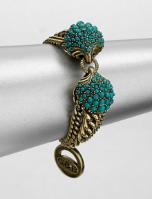 A Hellenic-inspired design that features a turquoise cabochon encrusted station and antique-finished brass link chains. TurquoiseAntique-finished brassLength, about 7.5Spring ring closureImported A Hellenic-inspired design that features a turquoise cabochon encrusted station and antique-finished brass link chains. TurquoiseAntique-finished brassLength, about 7.5Spring ring closureImported