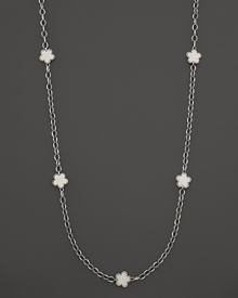 White mother-of-pearl floral stations punctuate this sterling silver link necklace from Lagos. White mother-of-pearl floral stations punctuate this sterling silver link necklace from Lagos.