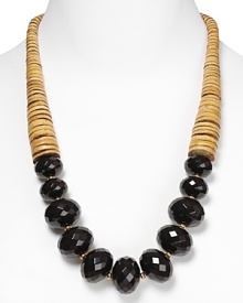 Tribal-inspired chic from RJ Graziano. This bold necklace marries graduated tan stone discs with multifaceted black beads for a versatile piece that works with a dress or dark jeans. Tribal-inspired chic from RJ Graziano. This bold necklace marries graduated tan stone discs with multifaceted black beads for a versatile piece that works with a dress or dark jeans.