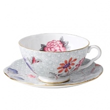 Step into a delightful garden party with Wedgwood's whimsical tea cup and saucer adds a flourish of color to your table with sophisticated and lively style. Step into a delightful garden party with Wedgwood's whimsical tea cup and saucer adds a flourish of color to your table with sophisticated and lively style.