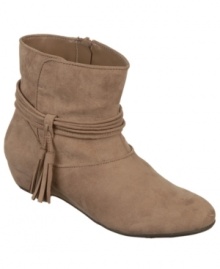 Fergalicious' Boho booties have fringe tassels that provide the perfect amount of decoration and movement. Slip them on over leggings for a truly trendy look. Fergalicious' Boho booties have fringe tassels that provide the perfect amount of decoration and movement. Slip them on over leggings for a truly trendy look.