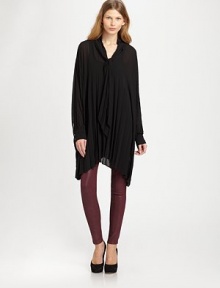 This semi-sheer, oversized top is defined by batwing sleeves, pleated bodice and asymmetrical hem.Neck tieBatwing sleeves with button cuffsPullover styleAsymmetrical hemSemi-sheerAbout 34 from shoulder to hemPolyesterDry cleanImportedSIZE & FIT Model shown is 5'11 (180cm) Please note: one size fits all. This semi-sheer, oversized top is defined by batwing sleeves, pleated bodice and asymmetrical hem.Neck tieBatwing sleeves with button cuffsPullover styleAsymmetrical hemSemi-sheerAbout 34 from shoulder to hemPolyesterDry cleanImportedSIZE & FIT Model shown is 5'11 (180cm) Please note: one size fits all.