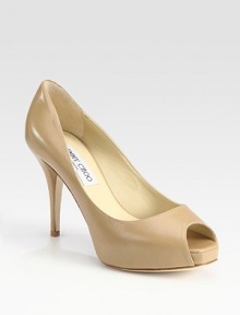 Creamy leather essential with a platform and classic peep toe. Self-covered heel, 4 (100mm)Covered platform, 1 (25mm)Compares to a 3 heel (75mm)Leather upperLeather liningBuffed leather solePadded insoleMade in ItalyOUR FIT MODEL RECOMMENDS ordering one half size up as this style runs small. Creamy leather essential with a platform and classic peep toe. Self-covered heel, 4 (100mm)Covered platform, 1 (25mm)Compares to a 3 heel (75mm)Leather upperLeather liningBuffed leather solePadded insoleMade in ItalyOUR FIT MODEL RECOMMENDS ordering one half size up as this style runs small.
