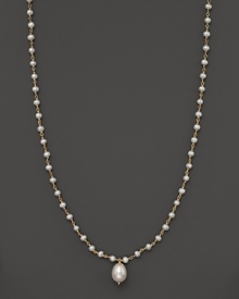 An iridescent freshwater pearl necklace with center pearl drop. An iridescent freshwater pearl necklace with center pearl drop.