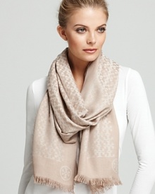 Tory Burch's iconic T is beautifully represented in this patterned oblong scarf. Tory Burch's iconic T is beautifully represented in this patterned oblong scarf.