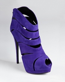 Bold in blue, Giuseppe Zanotti's Sharon platform booties make a statement with a towering heel and allover curvy cutouts. Bold in blue, Giuseppe Zanotti's Sharon platform booties make a statement with a towering heel and allover curvy cutouts.