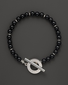 Black chalcedony gives a bold, classic look to a toggle bracelet from Gucci. Black chalcedony gives a bold, classic look to a toggle bracelet from Gucci.