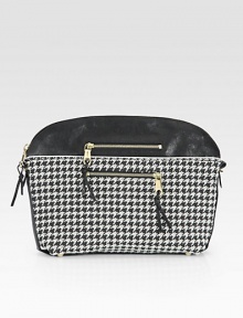 Graphic houndstooth fabric with leather trim and goldtone hardware.Top zip closureProtective metal feetTwo outside zip pocketsTwo inside open pocketsCotton lining14½W X 10½H X 3¼DMade in Italy Graphic houndstooth fabric with leather trim and goldtone hardware.Top zip closureProtective metal feetTwo outside zip pocketsTwo inside open pocketsCotton lining14½W X 10½H X 3¼DMade in Italy
