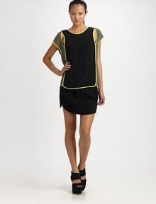 A sporty sheath of matte silk, finished with contrast piping and geometric cut-outs.Jewel necklineCap sleevesContour hem, slightly longer in backAbout 26 from shoulder to hemSilkDry cleanImported A sporty sheath of matte silk, finished with contrast piping and geometric cut-outs.Jewel necklineCap sleevesContour hem, slightly longer in backAbout 26 from shoulder to hemSilkDry cleanImported