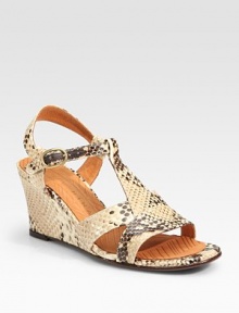 Snake-print leather t-strap with a chunky wedge and an adjustable ankle strap. Self-covered wedge, 3 (75mm)Snake-print leather upperLeather liningRubber and leather solePadded insoleImportedOUR FIT MODEL RECOMMENDS ordering one half size up as this style runs small. Snake-print leather t-strap with a chunky wedge and an adjustable ankle strap. Self-covered wedge, 3 (75mm)Snake-print leather upperLeather liningRubber and leather solePadded insoleImportedOUR FIT MODEL RECOMMENDS ordering one half size up as this style runs small.