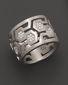 Brilliant diamonds pop against gleaming sterling silver in India Hicks' intriguing, geometric band ring. Brilliant diamonds pop against gleaming sterling silver in India Hicks' intriguing, geometric band ring.