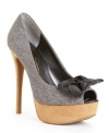 Shoes worth strutting in. The Para platform pumps by Jessica Simpson scream ooh-la-la with their sexy peep toe, bow accent and leg-lengthening height.