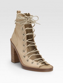 Supple Italian leather is liberated with a laced, open front. Stacked heel, 4 (100mm) Contrast stitching Inside side zip Leather lining and sole Padded insole Made in ItalyOUR FIT MODEL RECOMMENDS ordering one half size up as this style runs small. Supple Italian leather is liberated with a laced, open front. Stacked heel, 4 (100mm) Contrast stitching Inside side zip Leather lining and sole Padded insole Made in ItalyOUR FIT MODEL RECOMMENDS ordering one half size up as this style runs small.