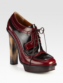 An island platform and towering wooden heel lift this two-tone patent leather silhouette with classic perforated details. Painted wooden heel, 5 (125mm)Island platform, 1 (25mm)Compares to a 4 heel (100mm)Patent leather upperLeather liningRubber solePadded insoleMade in Italy An island platform and towering wooden heel lift this two-tone patent leather silhouette with classic perforated details. Painted wooden heel, 5 (125mm)Island platform, 1 (25mm)Compares to a 4 heel (100mm)Patent leather upperLeather liningRubber solePadded insoleMade in Italy