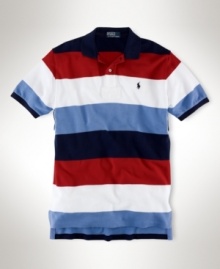 Rendered in breathable cotton mesh, a classic-fitting polo shirt is accented with bold stripes for a handsome, athletic look. Rendered in breathable cotton mesh, a classic-fitting polo shirt is accented with bold stripes for a handsome, athletic look.