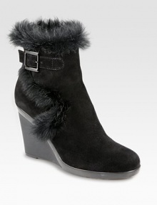 Practical yet fashion-forward, a heightened suede ankle boot trimmed with lush rabbit fur. Rubber wedge, 3¾ (95mm)Rubber platform, ½ (15mm)Compares to a 3¼ heel (80mm)Weatherproof suede upper with rabbit fur trimAdjustable buckle strap and inside zipBreathable microfiber liningSlip resistant rubber solePadded insoleMade in Italy Practical yet fashion-forward, a heightened suede ankle boot trimmed with lush rabbit fur. Rubber wedge, 3¾ (95mm)Rubber platform, ½ (15mm)Compares to a 3¼ heel (80mm)Weatherproof suede upper with rabbit fur trimAdjustable buckle strap and inside zipBreathable microfiber liningSlip resistant rubber solePadded insoleMade in Italy
