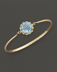 A faceted blue topaz adds brilliant color to gleaming 18K yellow gold. By Carelle. A faceted blue topaz adds brilliant color to gleaming 18K yellow gold. By Carelle.