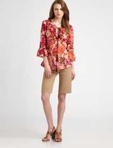 A brightly-colored, brushstroke print with ruffled details in lightweight cotton. Split tie neck with rufflesThree-quarter length sleeves with ruffled cuffsPull-on styleAbout 24½ from shoulder to hemCottonDry cleanImported Model shown is 5'9½ (176cm) wearing US size 4. A brightly-colored, brushstroke print with ruffled details in lightweight cotton. Split tie neck with rufflesThree-quarter length sleeves with ruffled cuffsPull-on styleAbout 24½ from shoulder to hemCottonDry cleanImported Model shown is 5'9½ (176cm) wearing US size 4.