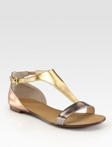 Shimmery metallic leather gladiator with a wide, adjustable t-strap and comfy padded insole. Metallic leather upperLeather liningBuffed leather solePadded insoleImportedOUR FIT MODEL RECOMMENDS ordering true size. Shimmery metallic leather gladiator with a wide, adjustable t-strap and comfy padded insole. Metallic leather upperLeather liningBuffed leather solePadded insoleImportedOUR FIT MODEL RECOMMENDS ordering true size.
