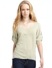 THE LOOKScoop necklinePullover styleThree-quarter length roll tab sleevesPleated detail on chestShirttail hemTHE FITAbout 25 from shoulder to longest point of hemTHE MATERIALViscoseCARE & ORIGINDry clean Made in USAModel shown is 5'10 (178cm) wearing US size 4. THE LOOKScoop necklinePullover styleThree-quarter length roll tab sleevesPleated detail on chestShirttail hemTHE FITAbout 25 from shoulder to longest point of hemTHE MATERIALViscoseCARE & ORIGINDry clean Made in USAModel shown is 5'10 (178cm) wearing US size 4.
