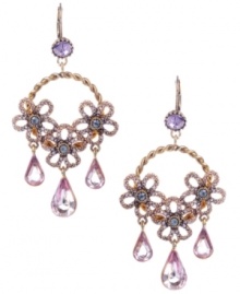 Flowers that will last forever. Betsey Johnson adds a magical touch to traditional hoop earrings with pink and purple-hued crystal flowers and a chic, twisted design. Crafted in antique gold-plated mixed metal. Approximate drop: 2-3/4 inches. Flowers that will last forever. Betsey Johnson adds a magical touch to traditional hoop earrings with pink and purple-hued crystal flowers and a chic, twisted design. Crafted in antique gold-plated mixed metal. Approximate drop: 2-3/4 inches.