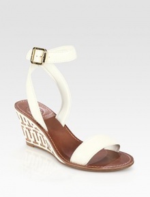 Logoed leather and cork wedge has intricate stitching and an adjustable, wrap-around ankle strap. Cork and leather wedge, 3 (75mm)Leather upperLeather liningRubber soleImportedOUR FIT MODEL RECOMMENDS ordering true size. Logoed leather and cork wedge has intricate stitching and an adjustable, wrap-around ankle strap. Cork and leather wedge, 3 (75mm)Leather upperLeather liningRubber soleImportedOUR FIT MODEL RECOMMENDS ordering true size.