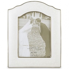 Opal Innocence, the popular china pattern from Lenox, lends a romantic feel to this fine china frame. Here, pearl-like enamel dots are elegant against an opalescent background. The frame, trimmed in precious platinum, makes a perfect engagement or wedding gift. The frame holds one 5 x 7 photo and is crafted of Lenox white bone china accented with precious platinum.Height: 9 1/2Width: 7 3/4 Opal Innocence, the popular china pattern from Lenox, lends a romantic feel to this fine china frame. Here, pearl-like enamel dots are elegant against an opalescent background. The frame, trimmed in precious platinum, makes a perfect engagement or wedding gift. The frame holds one 5 x 7 photo and is crafted of Lenox white bone china accented with precious platinum.Height: 9 1/2Width: 7 3/4