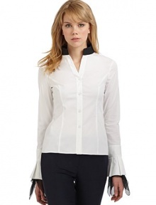 THE LOOKContrast stand collarLong sleeves with pleated cuffsAsymmetric contrast silk ruffles trim the cuffsButton frontTHE FITAbout 22 from shoulder to hemTHE MATERIAL97% cotton/3% other fibersSilk trimCARE & ORIGINDry cleanImportedModel shown is 5'10 (177cm) wearing US size 4. THE LOOKContrast stand collarLong sleeves with pleated cuffsAsymmetric contrast silk ruffles trim the cuffsButton frontTHE FITAbout 22 from shoulder to hemTHE MATERIAL97% cotton/3% other fibersSilk trimCARE & ORIGINDry cleanImportedModel shown is 5'10 (177cm) wearing US size 4.