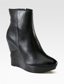 A timeless leather favorite resting on a sculpted wooden wedge. Wooden wedge, 4½ (115mm)Wooden platform, 1 (25mm)Compares to a 3½ heel (90mm)Leather upperSide zipLeather liningRubber solePadded insoleImported A timeless leather favorite resting on a sculpted wooden wedge. Wooden wedge, 4½ (115mm)Wooden platform, 1 (25mm)Compares to a 3½ heel (90mm)Leather upperSide zipLeather liningRubber solePadded insoleImported