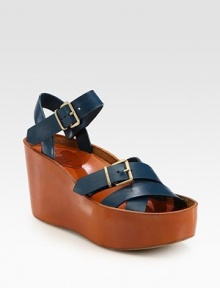 Rich leather wedge design with adjustable straps and a secure slingback. Leather-covered wooden wedge, 3½ (90mm)Covered platform, 2 (50mm)Compares to a 1½ heel (40mm)Leather upperLeather lining and soleMade in ItalyOUR FIT MODEL RECOMMENDS ordering true size. Rich leather wedge design with adjustable straps and a secure slingback. Leather-covered wooden wedge, 3½ (90mm)Covered platform, 2 (50mm)Compares to a 1½ heel (40mm)Leather upperLeather lining and soleMade in ItalyOUR FIT MODEL RECOMMENDS ordering true size.