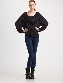 Fluid, shirred scoopneck with dramatic bell sleeves and an elastic waistband. Scoopneck Long bell sleeves Elastic waistband Back button keyhole closure Viscose Machine wash Imported Fluid, shirred scoopneck with dramatic bell sleeves and an elastic waistband. Scoopneck Long bell sleeves Elastic waistband Back button keyhole closure Viscose Machine wash Imported