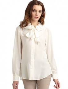 THE LOOKRuffle collarTie-neckButton frontLong sleeves with button cuffsShirttail hemSeamed back yokeTHE FITAbout 27 from shoulder to hemTHE MATERIALSilkCARE & ORIGINDry cleanMade in ItalyModel shown is 5'10 (177cm) wearing US size 4. THE LOOKRuffle collarTie-neckButton frontLong sleeves with button cuffsShirttail hemSeamed back yokeTHE FITAbout 27 from shoulder to hemTHE MATERIALSilkCARE & ORIGINDry cleanMade in ItalyModel shown is 5'10 (177cm) wearing US size 4.