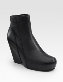 Sleek leather wedge with an urban-cool covered platform and convenient side zipper. Self-covered wedge, 4 (100mm)Covered platform, 1 (25mm)Compares to a 3 heel (75mm)Leather upperSide zipperLeather lining and solePadded insoleMade in Italy Sleek leather wedge with an urban-cool covered platform and convenient side zipper. Self-covered wedge, 4 (100mm)Covered platform, 1 (25mm)Compares to a 3 heel (75mm)Leather upperSide zipperLeather lining and solePadded insoleMade in Italy