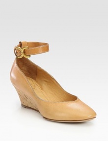 Leather round toe with a natural cork wedge and adjustable, wrap-around buckle strap. Cork wedge, 2 (50mm)Leather upperLeather lining and solePadded insoleMade in ItalyOUR FIT MODEL RECOMMENDS ordering one half size up as this style runs small. Leather round toe with a natural cork wedge and adjustable, wrap-around buckle strap. Cork wedge, 2 (50mm)Leather upperLeather lining and solePadded insoleMade in ItalyOUR FIT MODEL RECOMMENDS ordering one half size up as this style runs small.