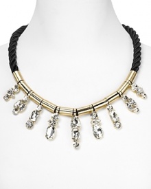 Crystal stones dress up a twisted cord on this collar necklace from nOir. Equal parts crafty and cool, it instantly adds some summer-perfect sparkle. Crystal stones dress up a twisted cord on this collar necklace from nOir. Equal parts crafty and cool, it instantly adds some summer-perfect sparkle.