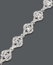Sophistication and elegance combine in this eye-catching bracelet by Charter Club. Round crystals in an eye pattern sit in a silver tone mixed metal setting. Approximate length: 7 inches. Sophistication and elegance combine in this eye-catching bracelet by Charter Club. Round crystals in an eye pattern sit in a silver tone mixed metal setting. Approximate length: 7 inches.