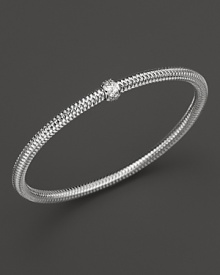 A single diamond station shines on this modern 18K white gold mesh bangle from Roberto Coin. A single diamond station shines on this modern 18K white gold mesh bangle from Roberto Coin.