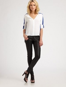 Bold colorblock trim elevates this tailored blouse styled in a slightly boxy silhouette.V-neckSlightly gathered shouldersCuffed sleevesTonal bindingHi-lo hemPolyesterDry cleanImportedModel shown is 5'9½ (176cm) wearing US size Small. Bold colorblock trim elevates this tailored blouse styled in a slightly boxy silhouette.V-neckSlightly gathered shouldersCuffed sleevesTonal bindingHi-lo hemPolyesterDry cleanImportedModel shown is 5'9½ (176cm) wearing US size Small.